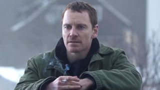Michael Fassbender looks at something offscreen