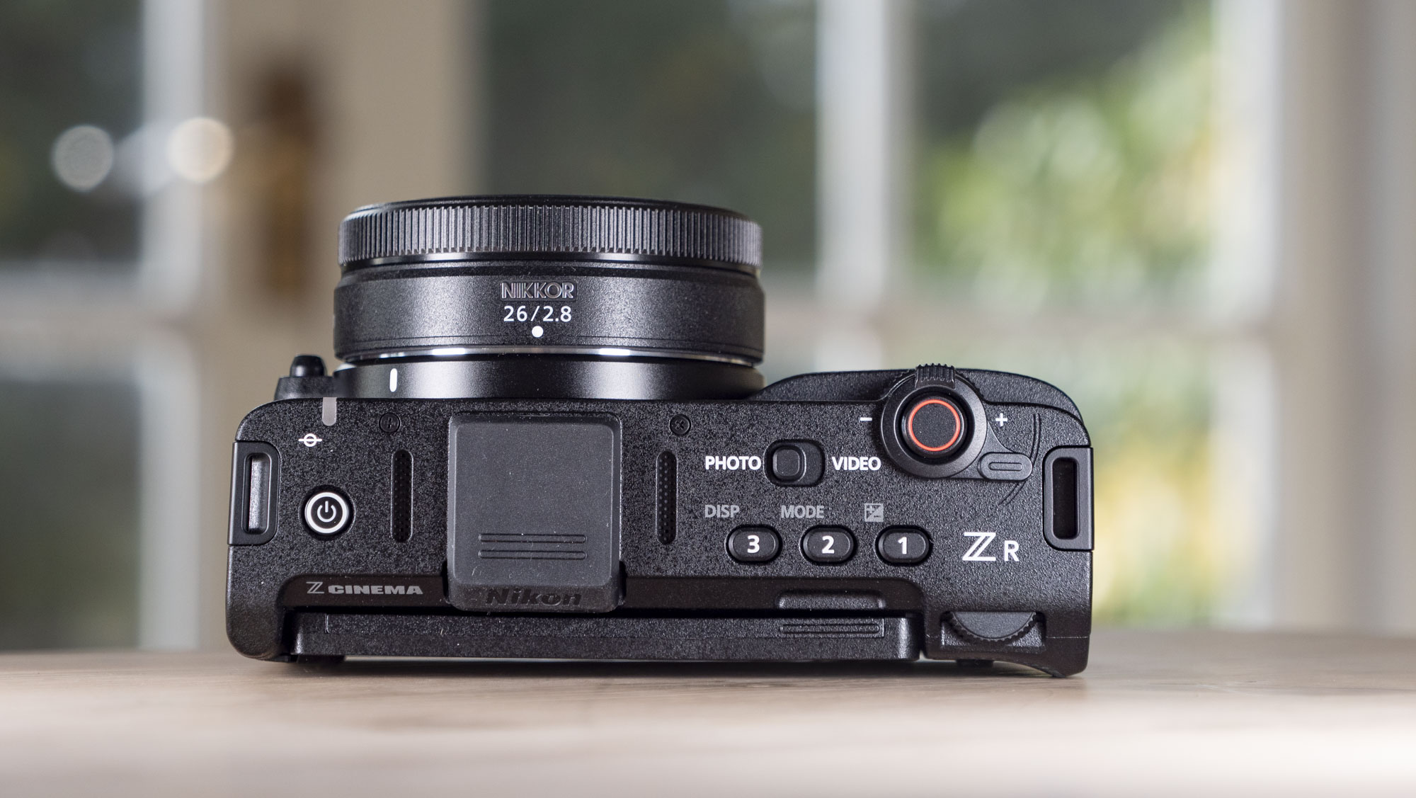 Nikon ZR product photos – camera on a wooden table, view of its top plate