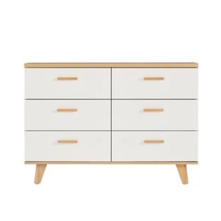 A set of two-toned white drawers with warm brown handles and feet