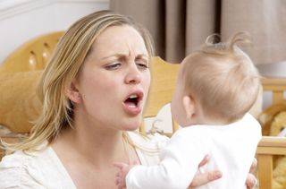 woman stressed with baby