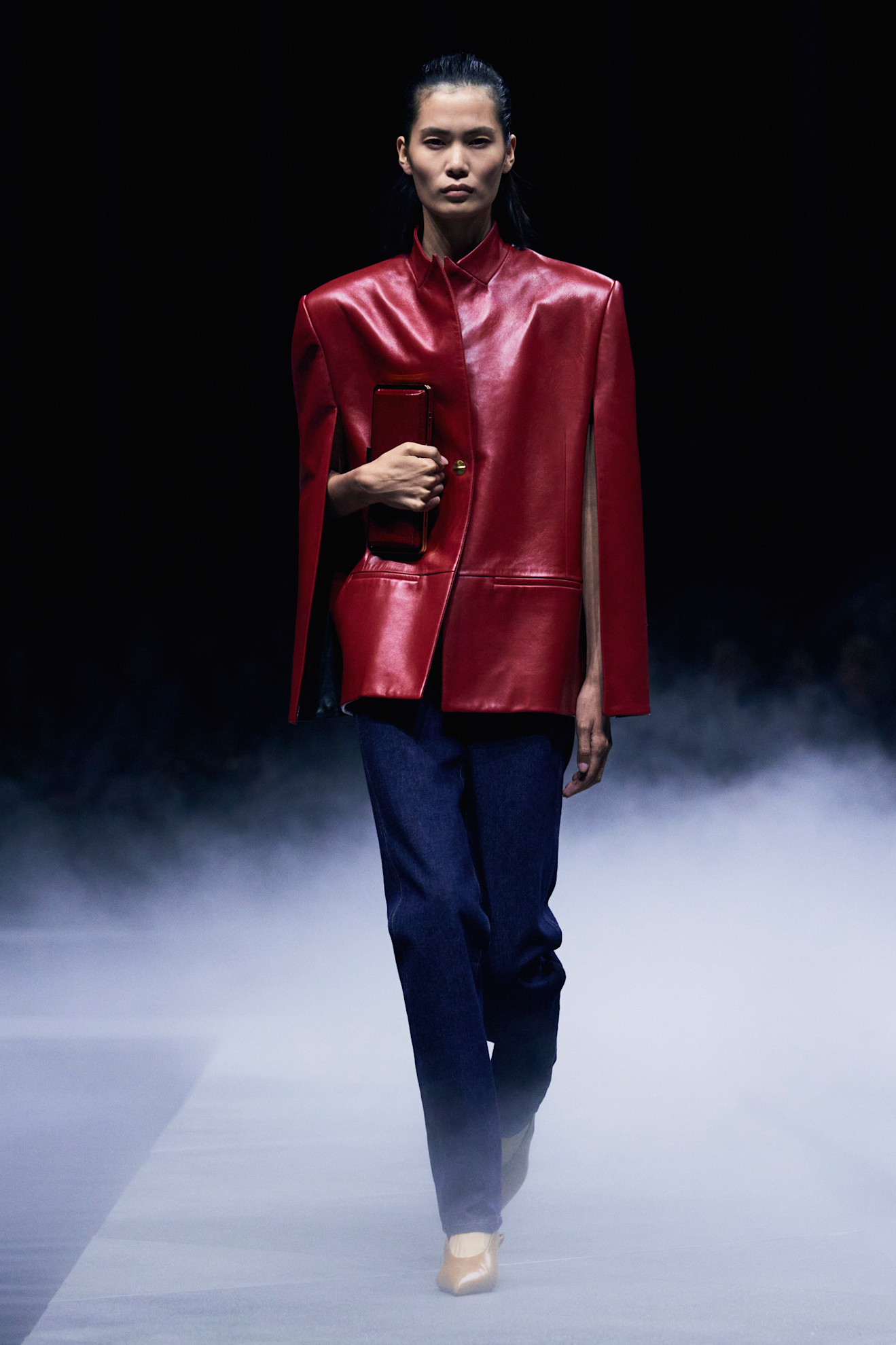 A model wore the navy and burgundy color combination on the Khaite Spring 2026 runway