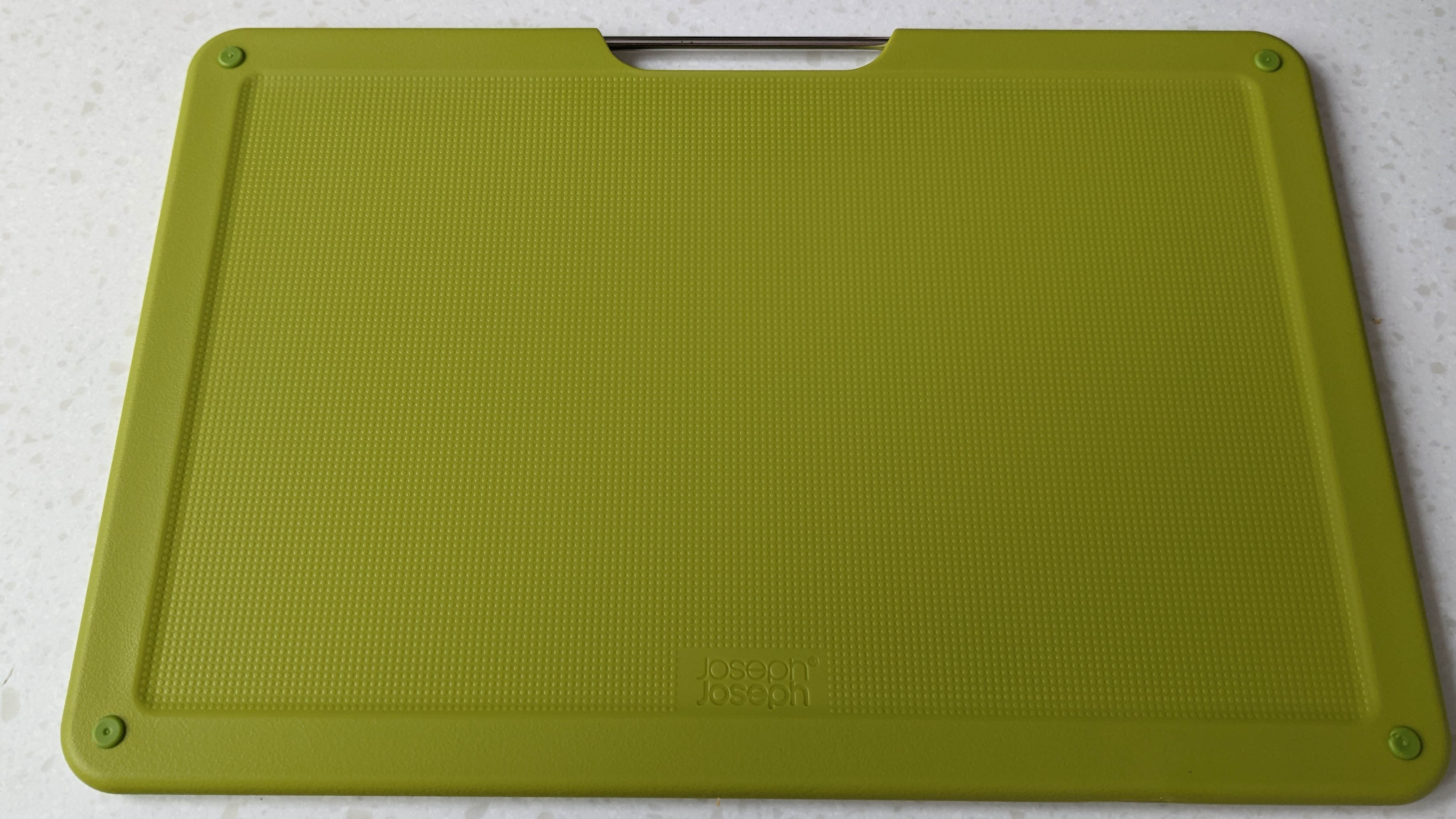 Cutting board with non-slip pads