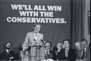 British prime minister candidate Margaret Thatcher speaks at a podium in an arena during the 1979 parliamentary election.