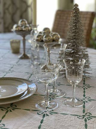 A Christmas table with bowls of ornaments