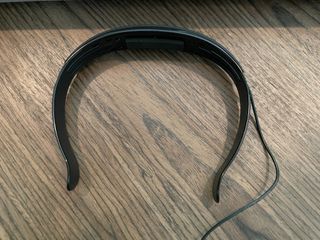 Tuning headband for Bose Smart Soundbar 900 resting on wooden tabletop