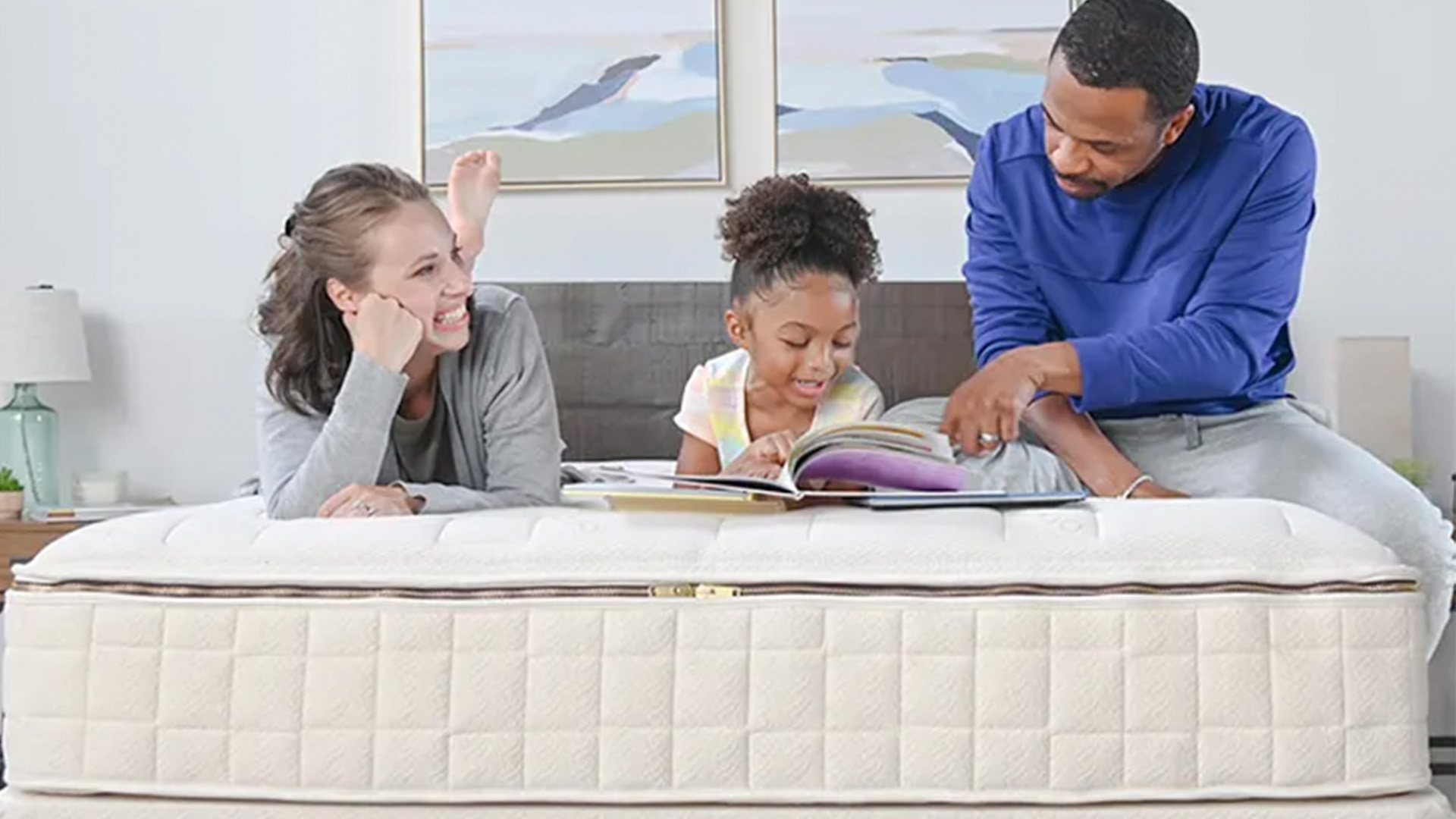 A family lying on a Naturepedic EOS mattress