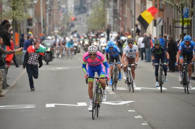 Michele Scarponi attacks. Dan Martin waits.