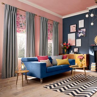 living room with pink and blue walls