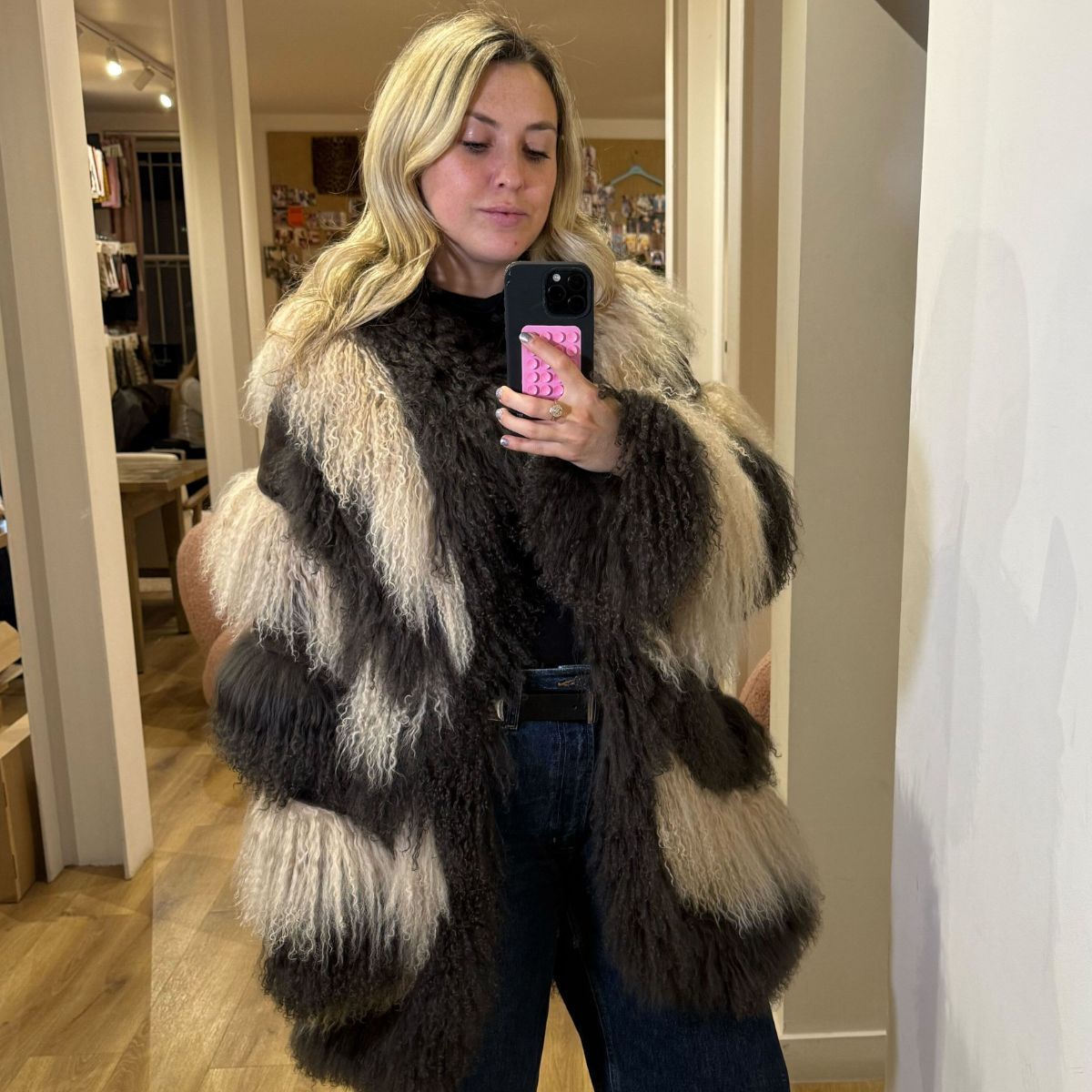 clementina jackson tries on a furry coat from charlotte simone&#039;s new collection