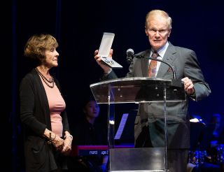 NASA Administrator Bill Nelson presents Jeannie Schulz, widow of Peanuts gang creator Charles M. Schulz, with a NASA Exceptional Public Achievement Medal at the John F. Kennedy Center for the Performing Arts on Wednesday, April 5, 2023.