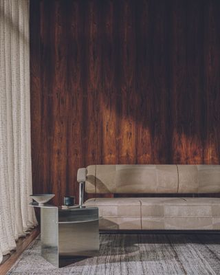 Steel side table with soft grey sofa