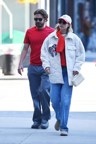 Gigi Hadid and Bradley Cooper wearing pops of cherry red in NYC.