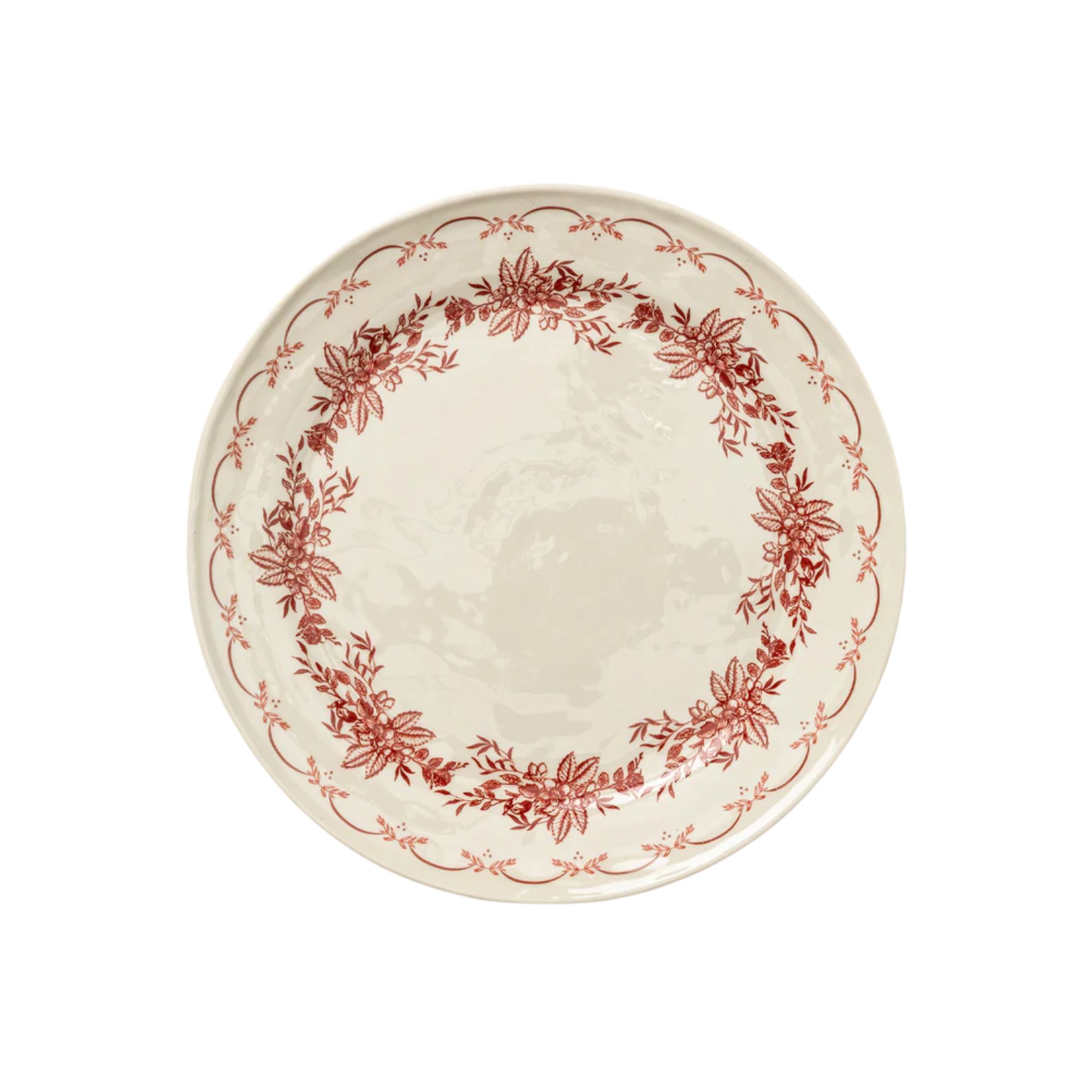 White dinner plate with red floral design around the rim