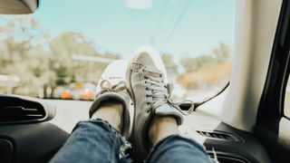 Feet up on dashboard