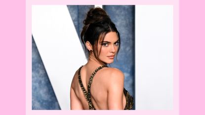 Kendall Jenner wears a strappy, backless floral, gold and black dress as she attends the 2023 Vanity Fair Oscar Party hosted by Radhika Jones at Wallis Annenberg Center for the Performing Arts on March 12, 2023 in Beverly Hills, California/ in a pink template
