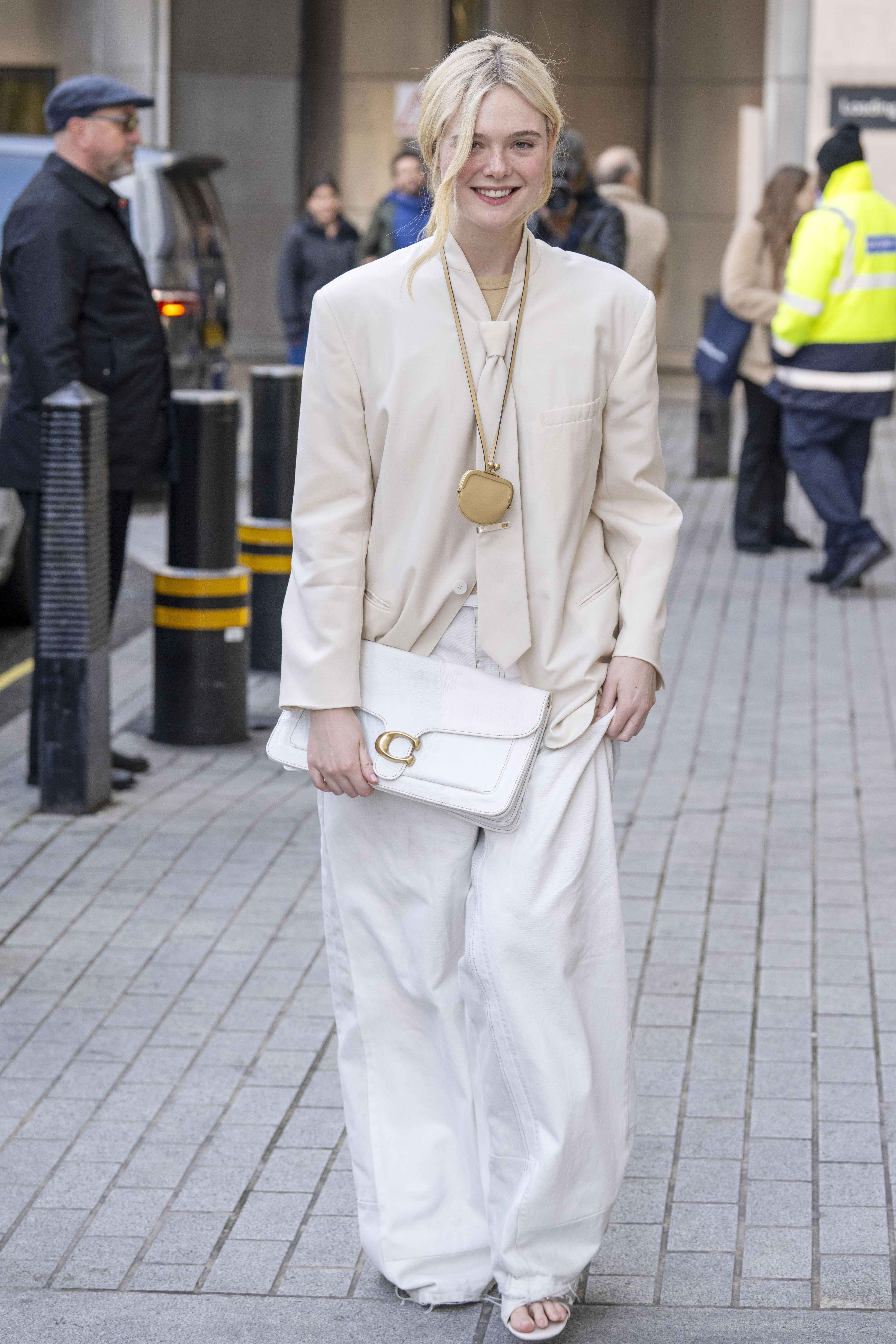 Elle Fanning wearing a Coach outfit in London