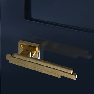 brass art deco style interior door handle on door