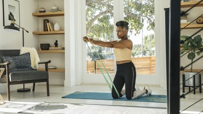 Woman exercising with resistance bands