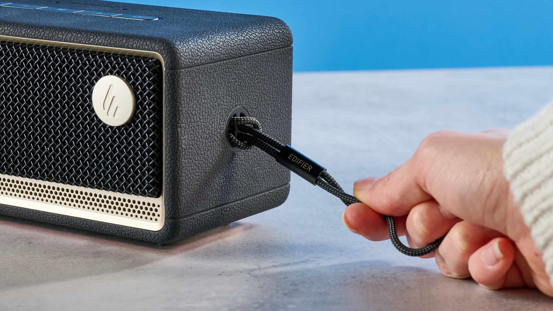 A black Edifier ES60 Bluetooth speaker