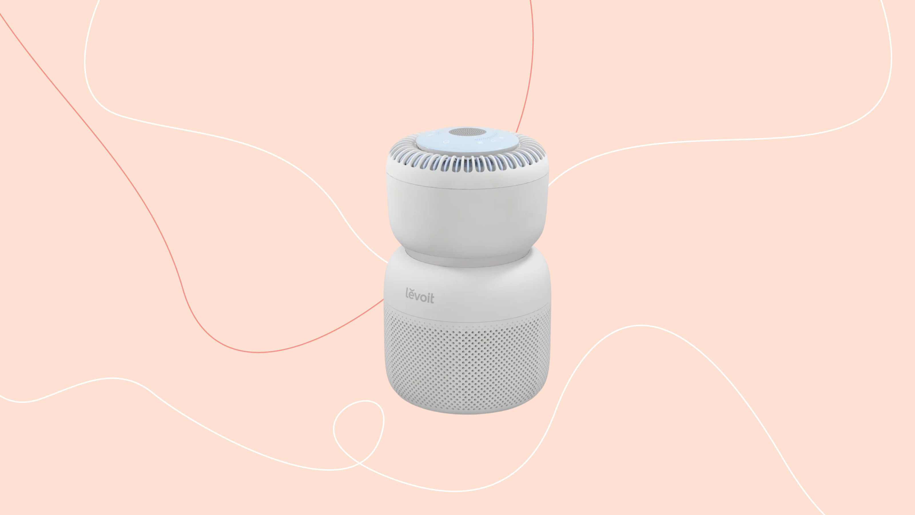levoit sprout air purifier on a pink graphic background