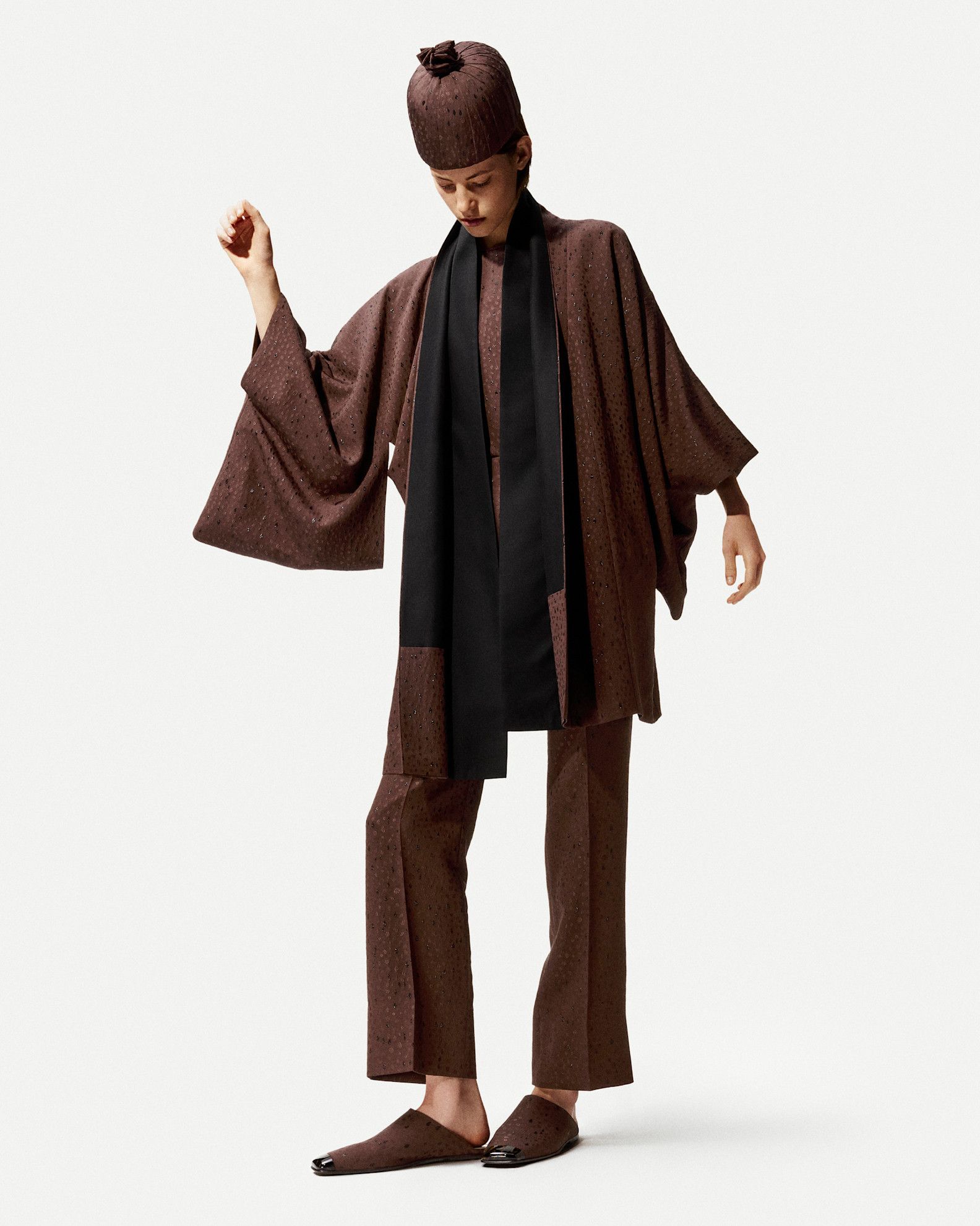 A model in the S/S 26 Loro Piana lookbook wearing dipped-toe shoes.