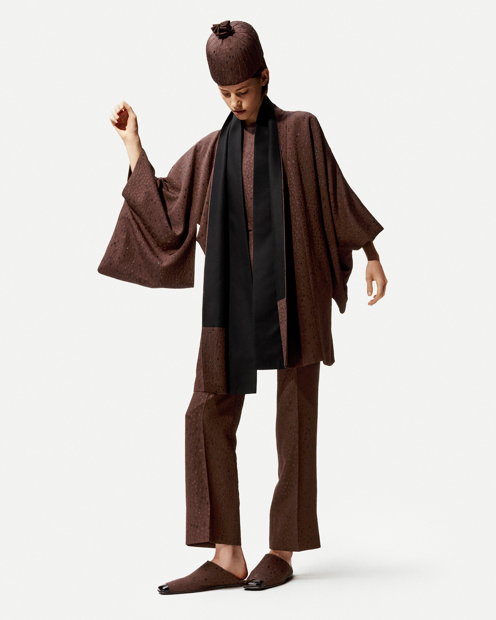 A model in the S/S 26 Loro Piana lookbook wearing dipped-toe shoes.