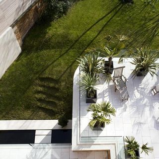 house with lawn area and white flooring