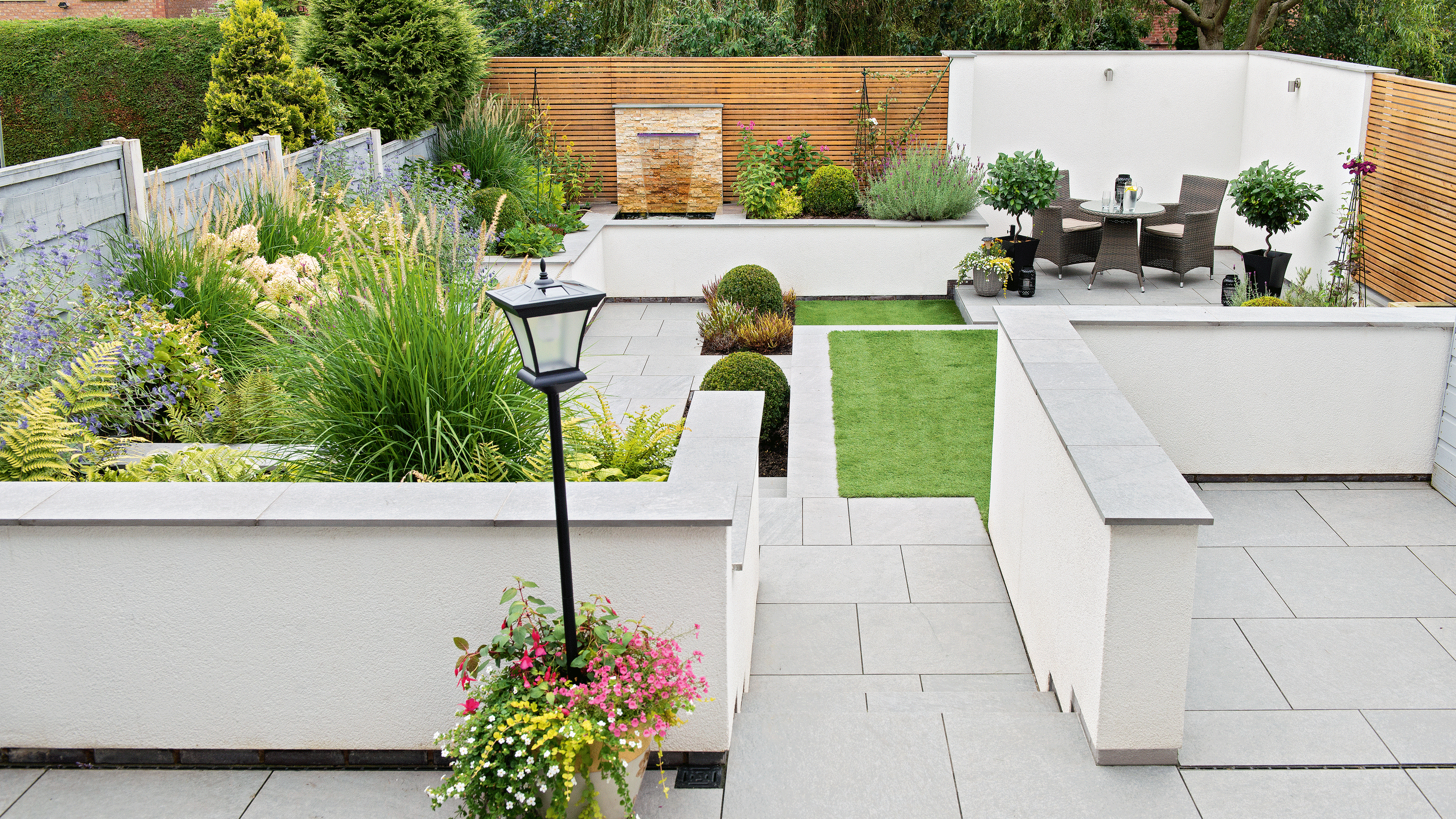 White rendered wall with bistro set