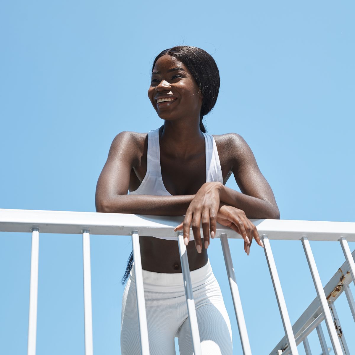 How to add variety to your walks: A woman leaning against a railing