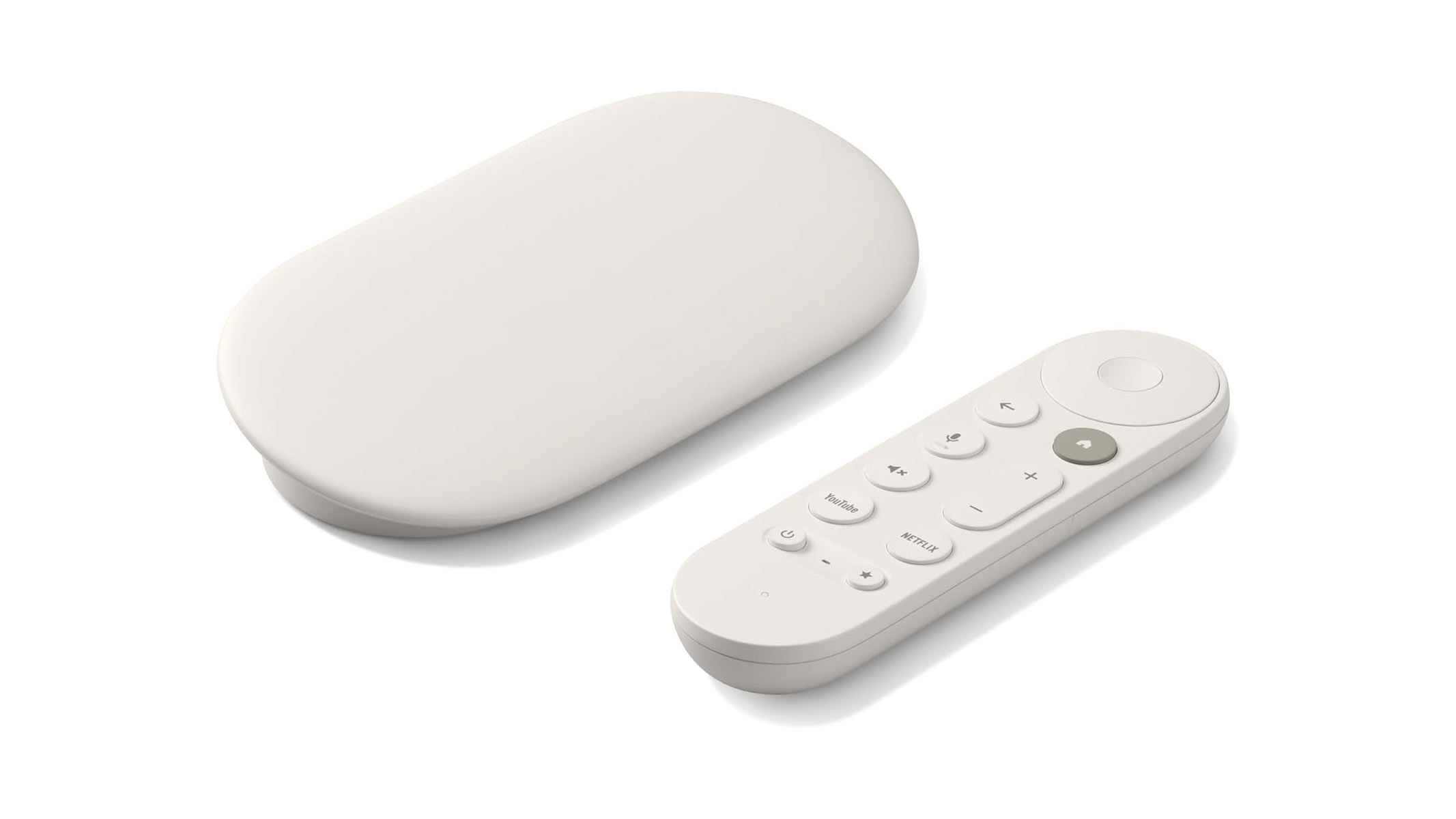A white, oval/tablet-shaped device is laid next to a white remote controller, both on a white background.