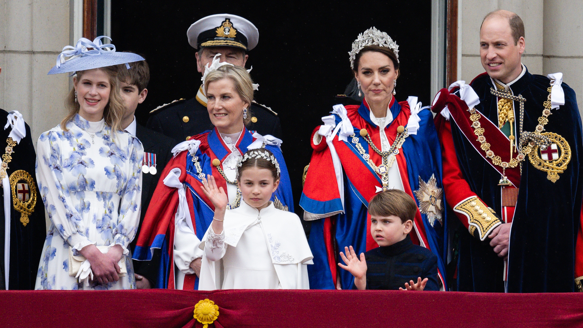 Lady Louise Windsor, Sir Timothy Laurence, Sophie, Duchess of Edinburgh, Princess Charlotte, Princess Anne, Princess Royal, Catherine, Princess of Wales, Prince Louis and Prince William stand on the balcony during the Coronation of King Charles III and Queen Camilla on May 06, 2023 in London