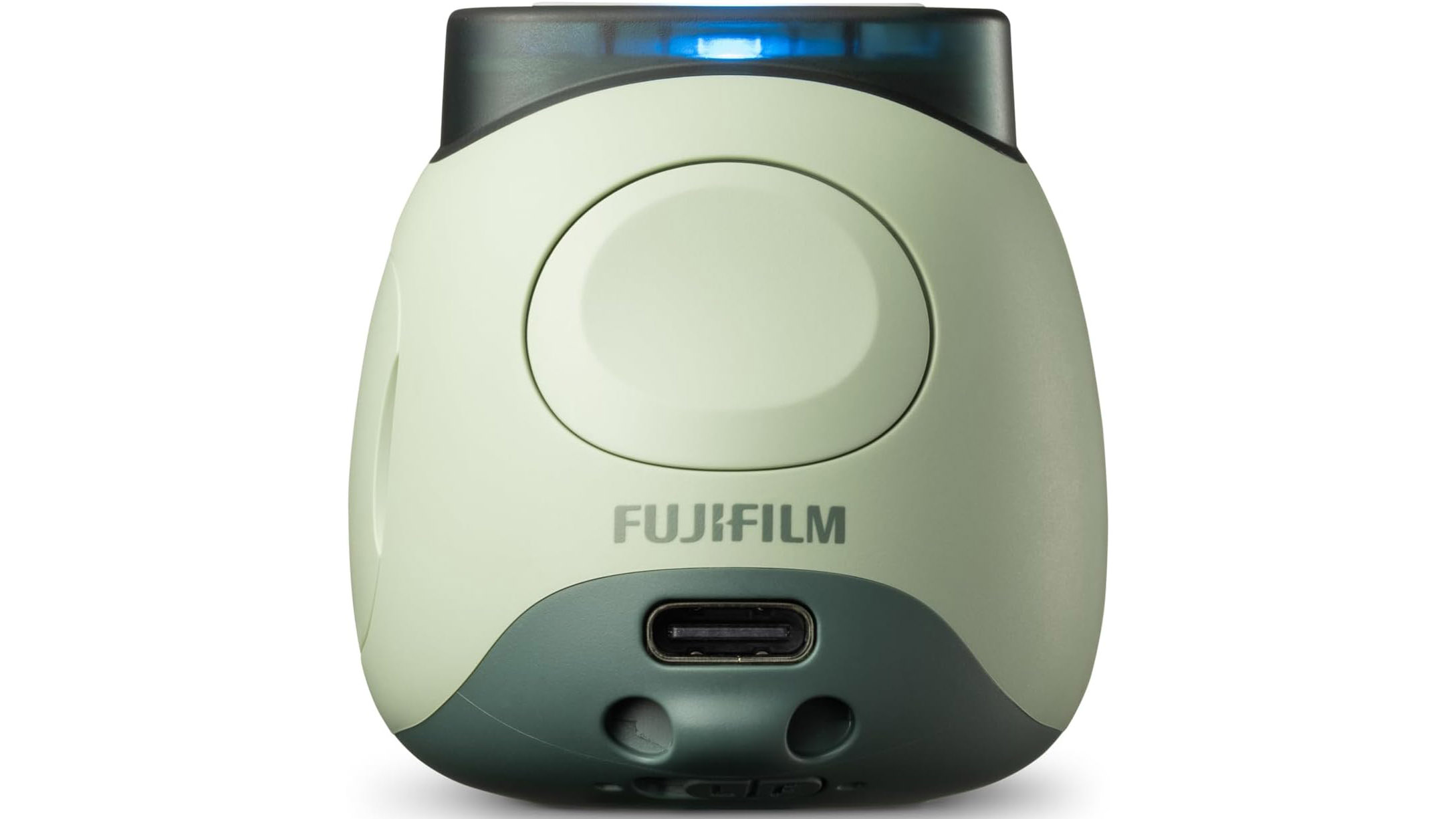 This image shows the back of the Fujifilm Instax Pal in green color on a white background. There is no screen, but there is a USB-C port on the back for charging