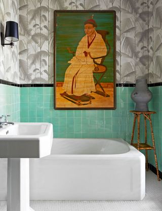 built in bathtub with tropical wallpaper and green tiles