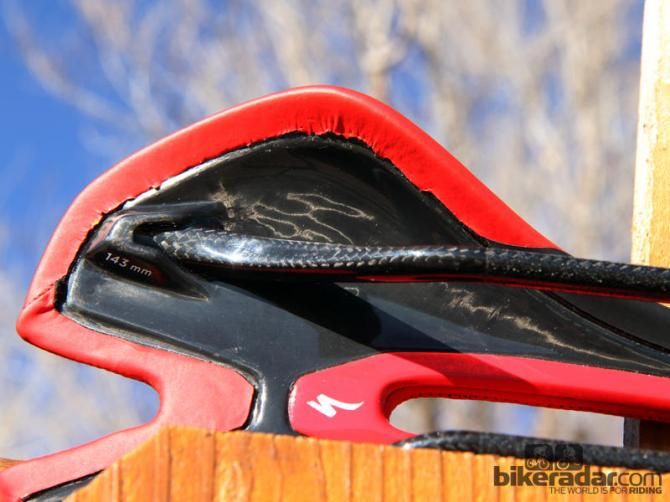 Woven carbon fiber rails and a carbon fiber shell help keep weight on the top-end S-Works model to just 153g