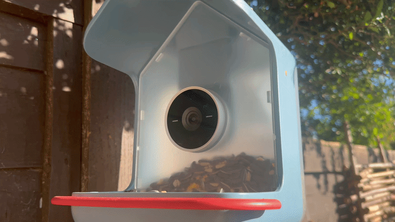 The Bird Buddy 2 camera being removed and rotated