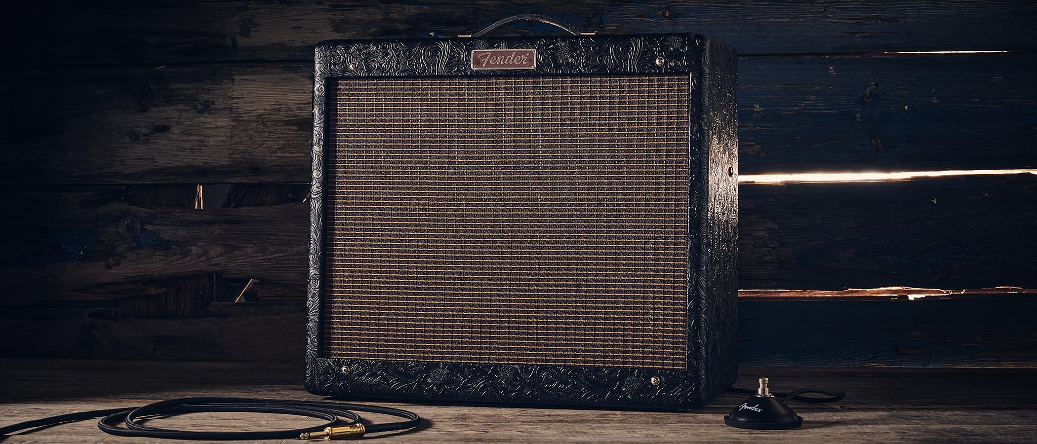 Fender Blues Junior IV 30th Anniversary: the classic combo is refinished with a touch of cowboy western flair, and is here photographed against some weathered floorboards in close-up