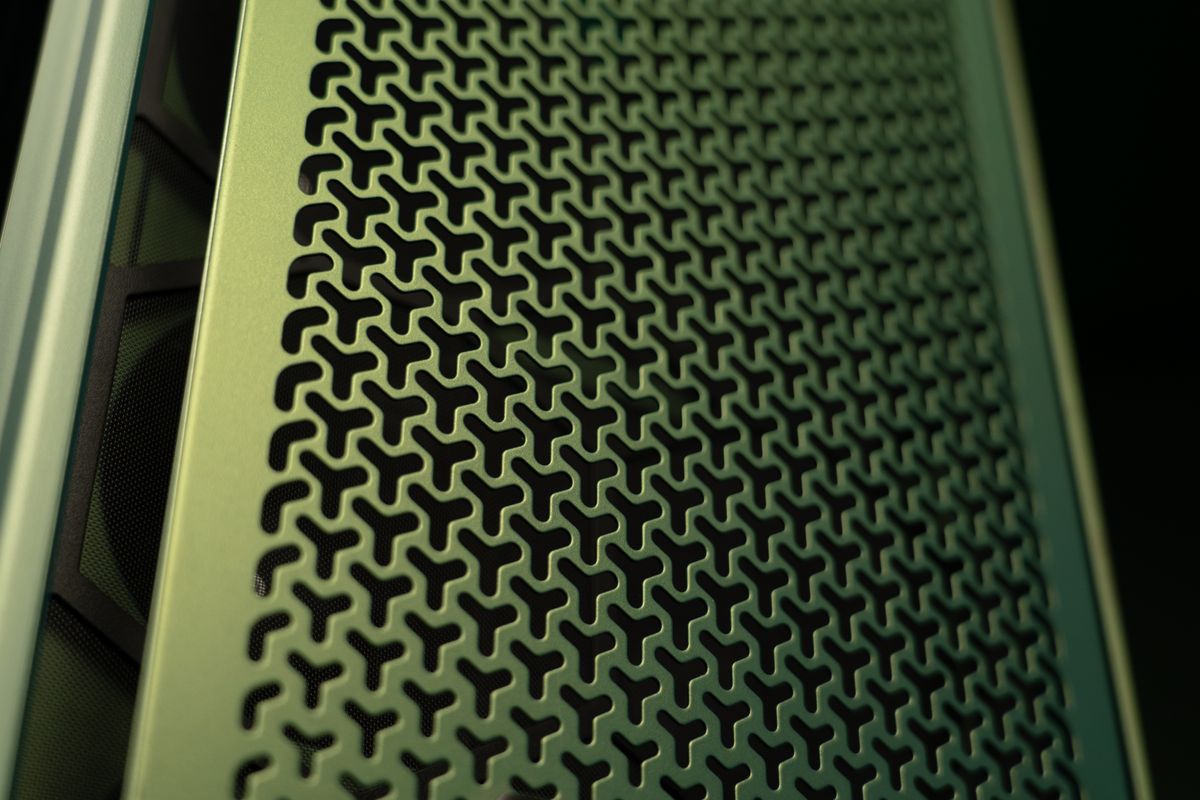 A PC gaming rig designed by Aston Martin, green with wood pannelling