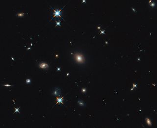 Shown here, shows the foreground lensing galaxy (observed with Hubble), and the gravitationally lensed galaxy SDP.81, which forms an almost perfect Einstein Ring, is hardly visible.