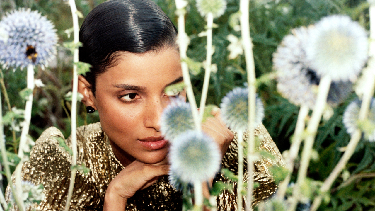 model in a field of flowers