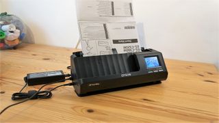 Epson ES-C380W scanner on a desk during our testing process