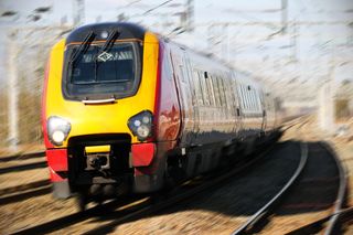 Image of a commuter train moving at high speed