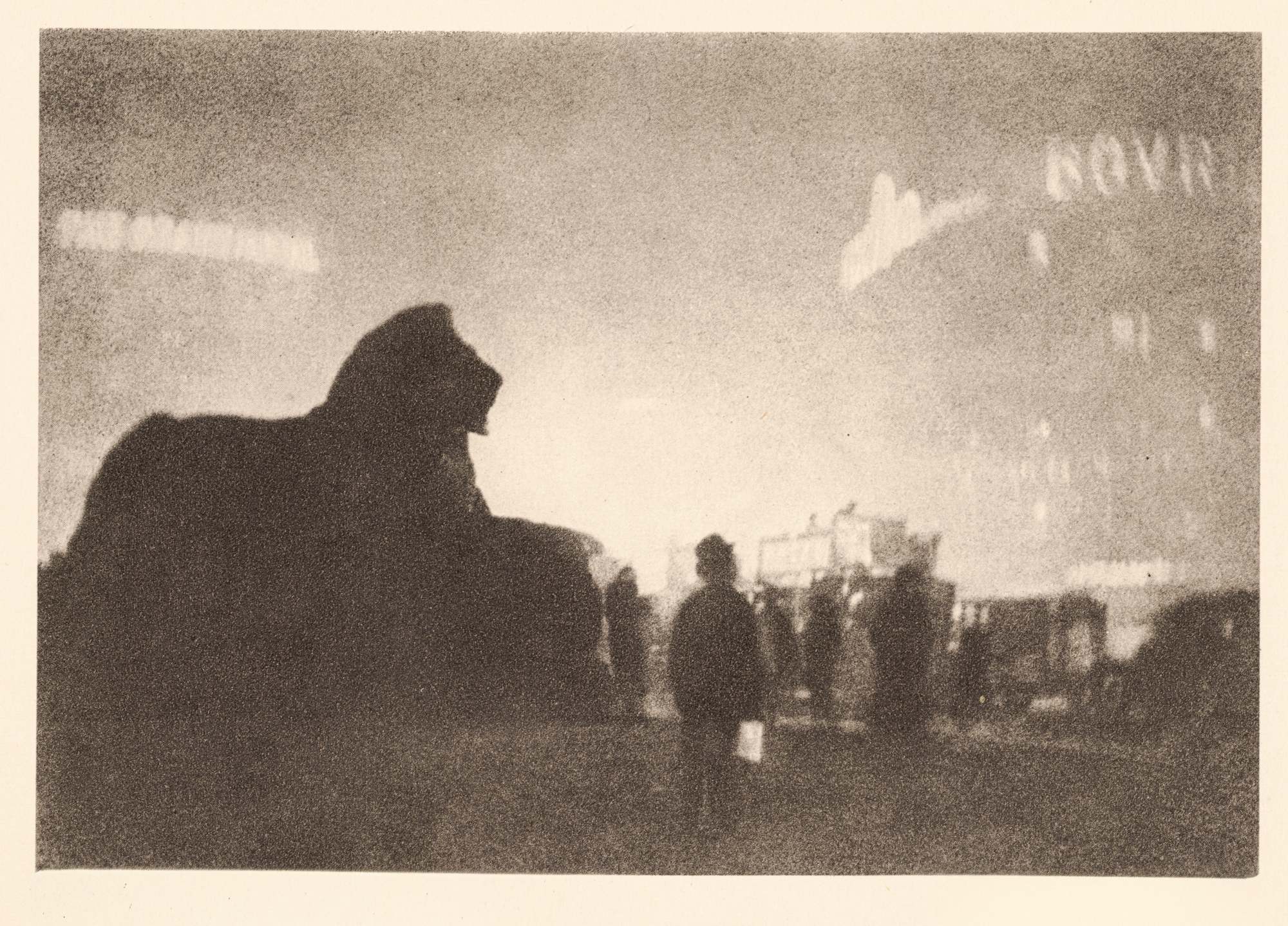 A grainy 1924 photogravure showing the silhouette of a Trafalgar Square lion statue against a hazy, illuminated London night sky, with a lone figure standing nearby and faint lit signage in the distance.