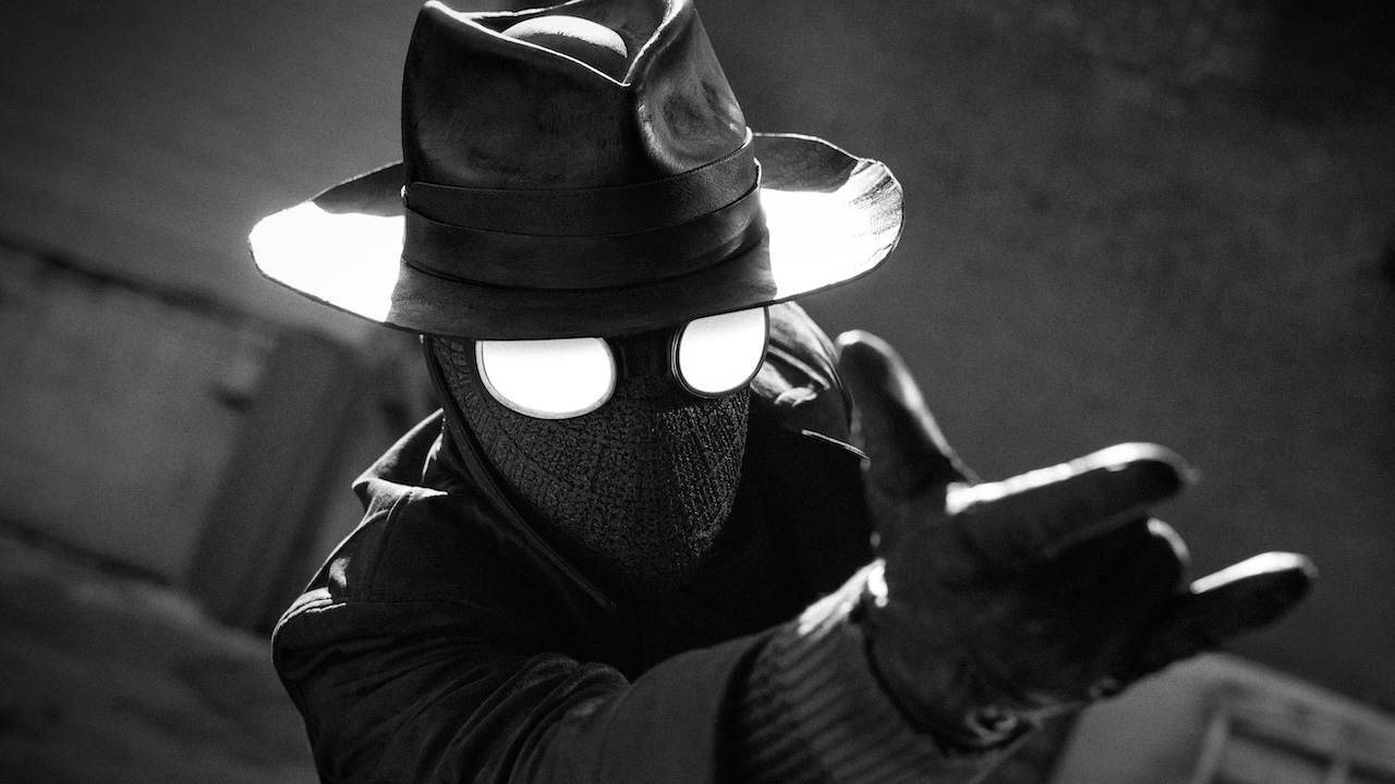 Live-action Spider-Man Noir making the web-shooting gesture with his hand