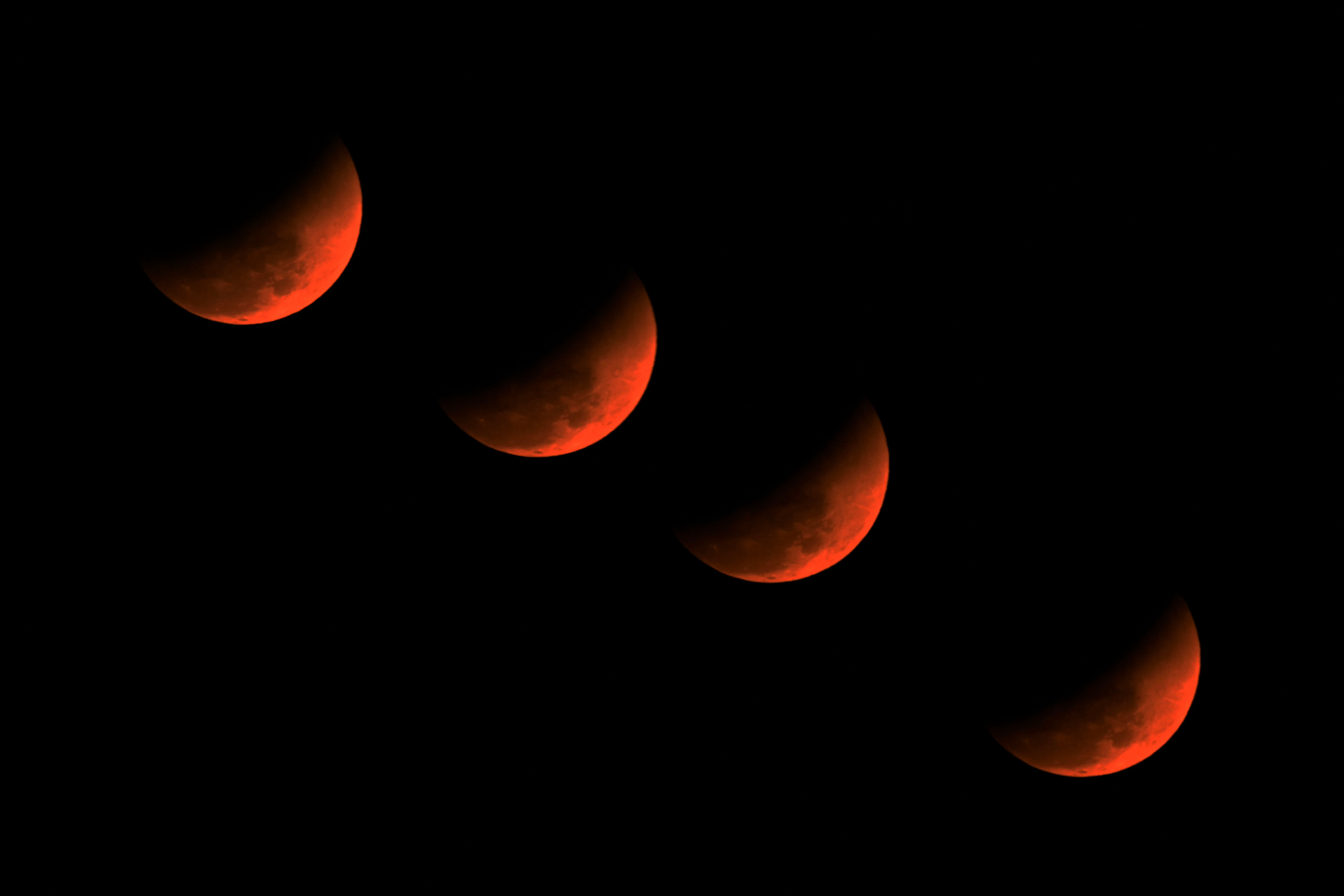A multiple exposure picture of the &amp;lsquo;blood moon&amp;rsquo; over Golaghat in Assam, India.