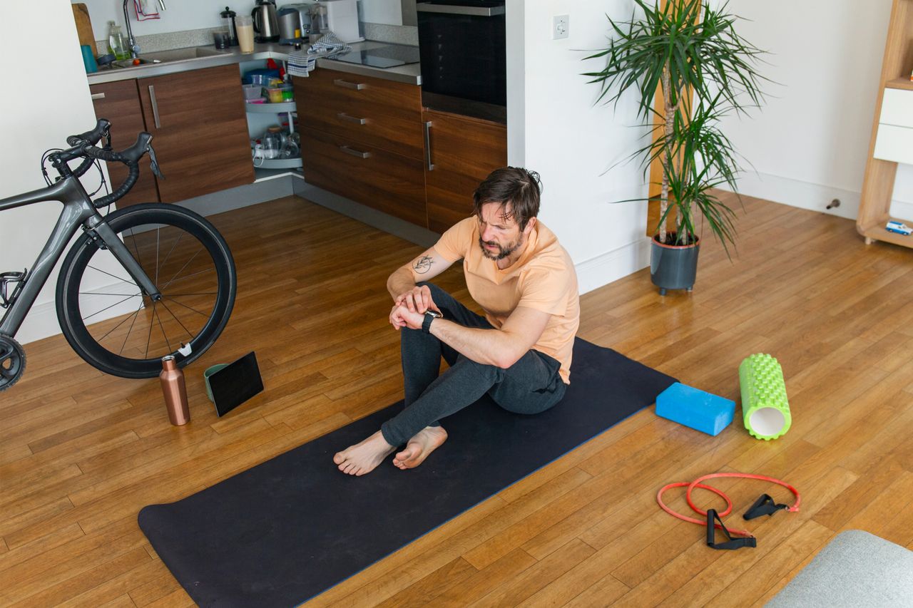 Image shows a rider completing a home workout to stay injury free 