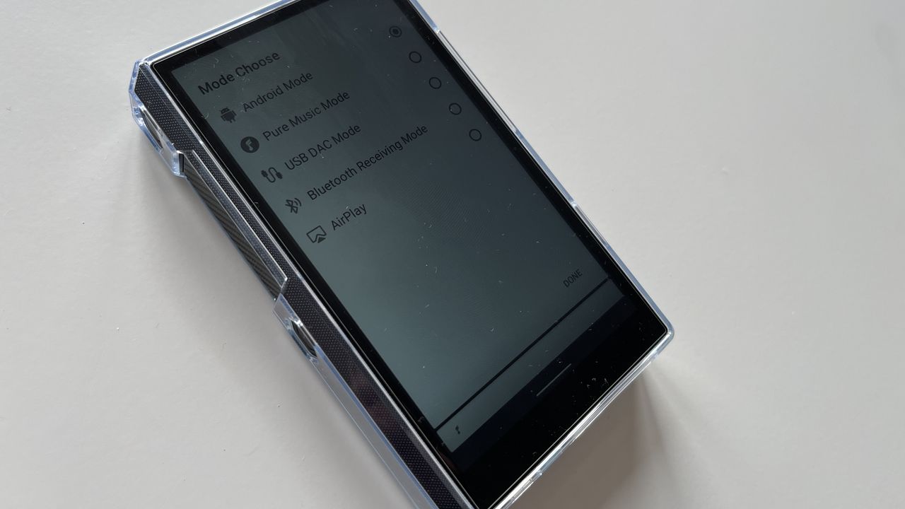 The FiiO M11S music player displaying the different modes while on a plain white surface