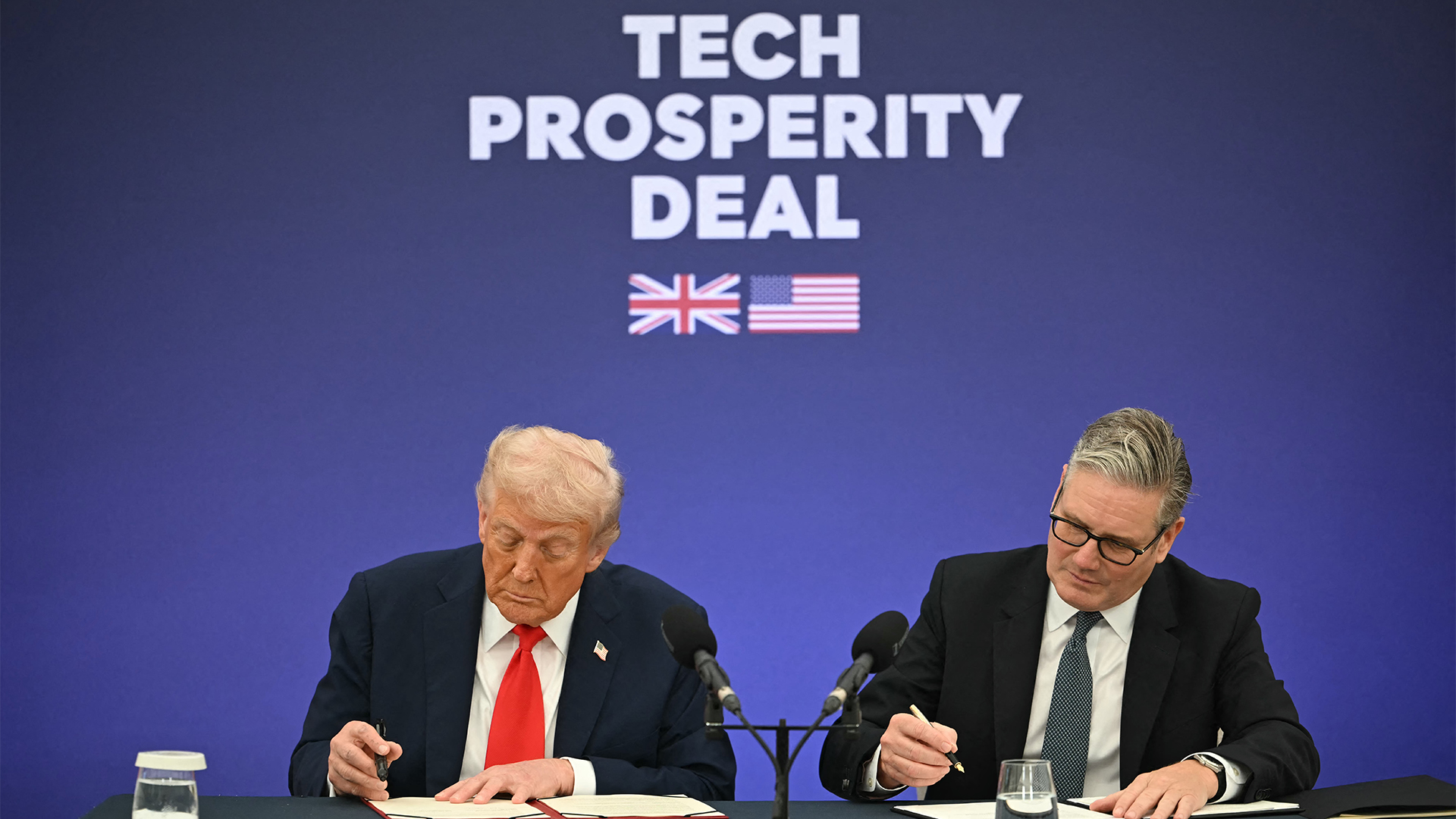 US President Donald Trump and UK Prime Minister Kier Starmer signing the UK-US Tech Prosperity Deal at Chequers, in Aylesbury, UK.