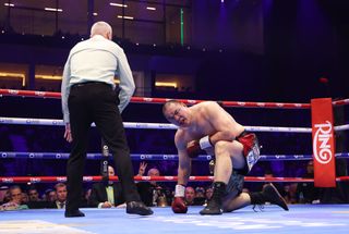 Zhilei Zhang reacts to being knocked down and stopped by Agit Kabayel (not pictured) during the WBC Interim World Heavyweight Title fight between Zhilei Zhang and Agit Kabayel as part of Beterbiev v Bivol 2: The Last Crescendo at Kingdom Arena on February 22, 2025 in Riyadh, Saudi Arabia.