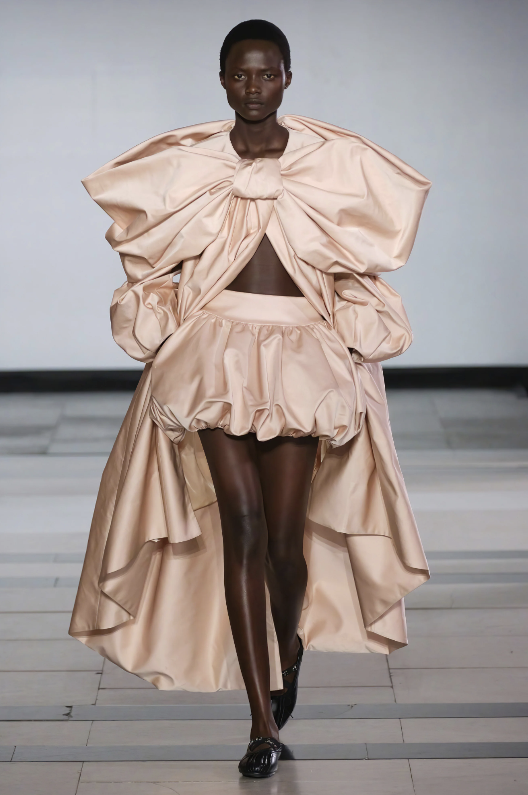 Simone Rocha ss26 pink satin bubble hem skirt and cape runway look
