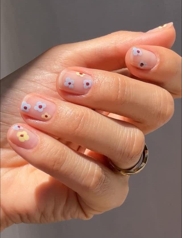 Photo of Betina Goldstein wearing daisy nails
